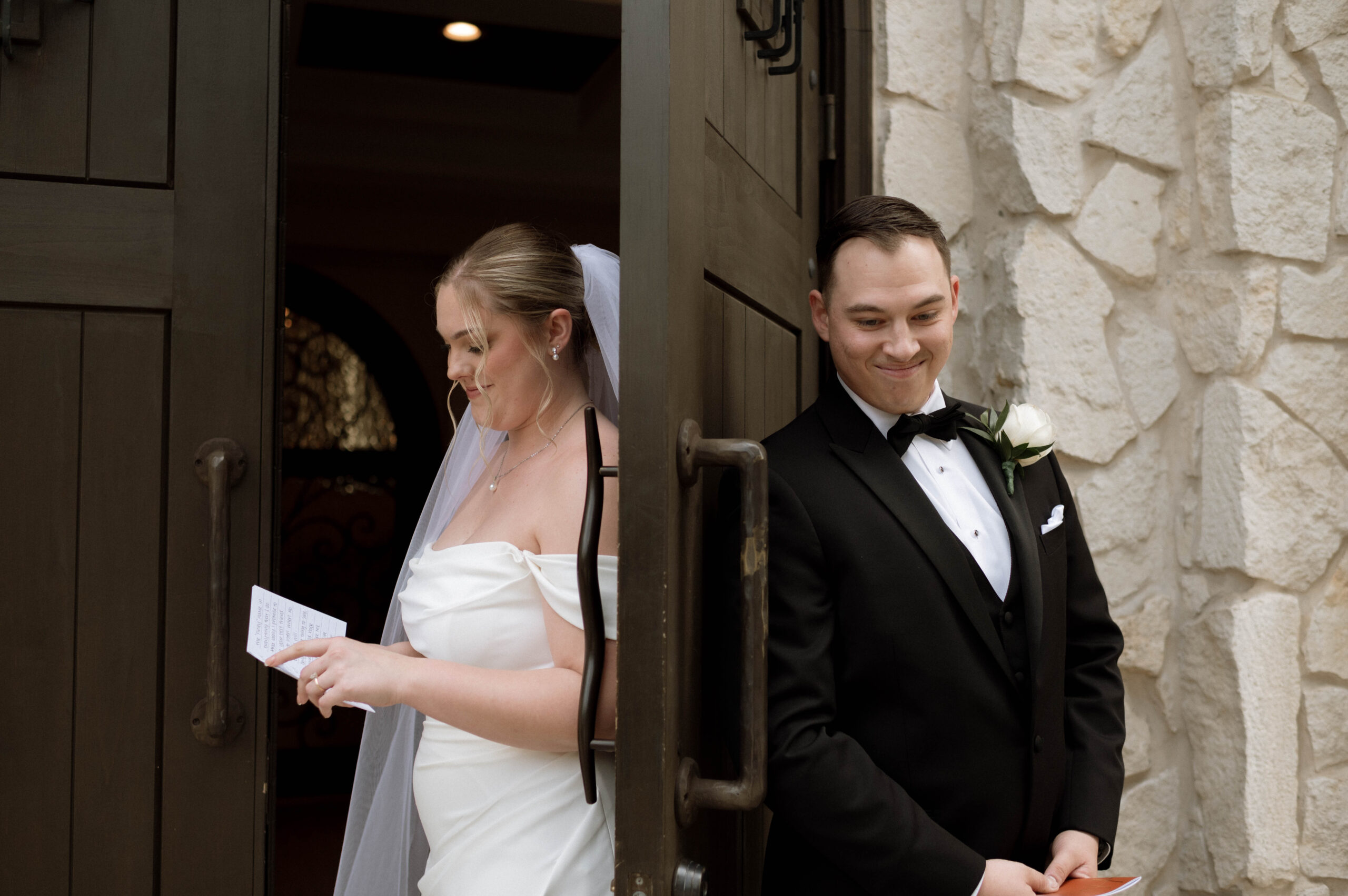 Bride and groom reading private vows during first touch taken by DFW wedding photographer Nicole Endress Photography