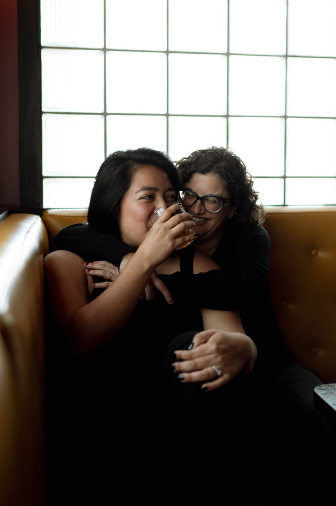 couple hanging out in a bar taken by DFW wedding photographer Nicole Endress Photography