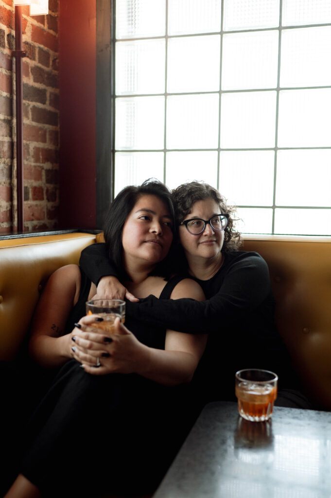 couple hugging in bar taken by DFW wedding photographer Nicole Endress Photography