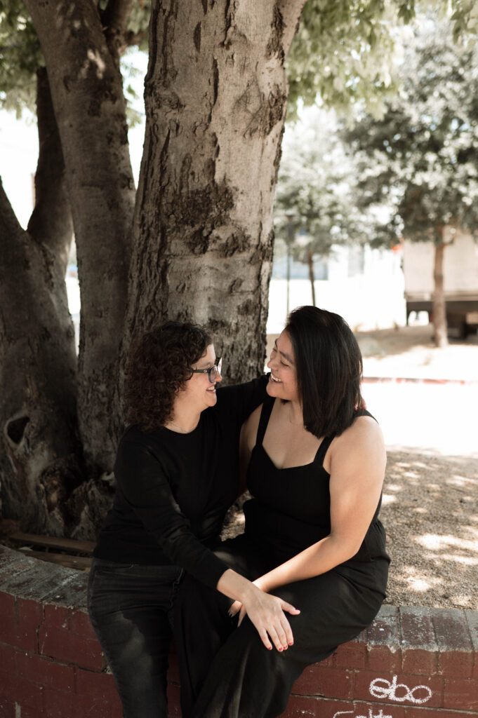 couple sitting together outside taken by DFW wedding photographer Nicole Endress Photography