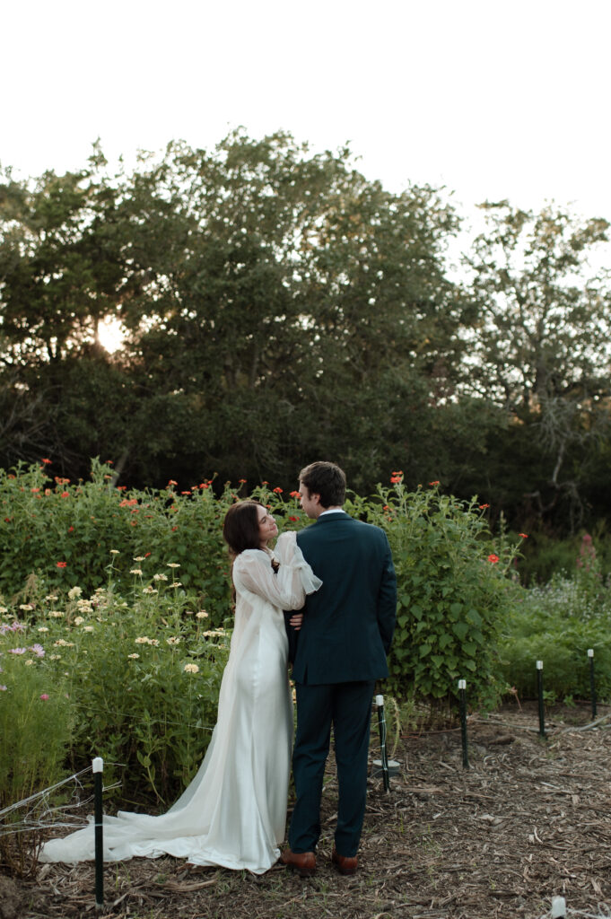 Bride & Groom having a moment in the garden at The Grand Lady in Austin, TX taken by DFW wedding photographer Nicole Endress Photography