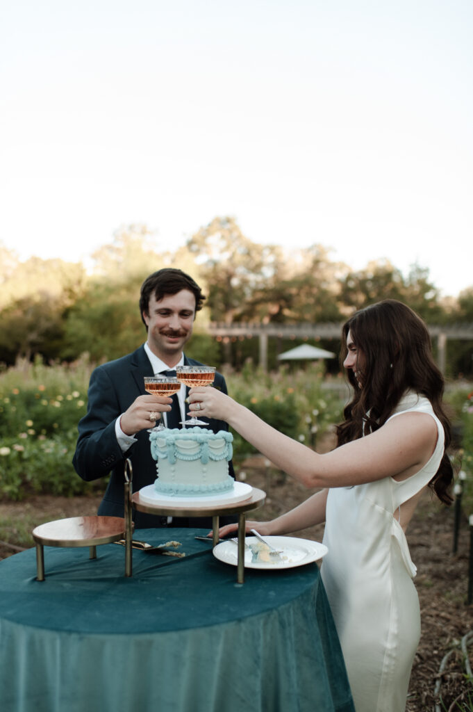 Bride & groom sharing a drink in the garden at The Grand Lady in Austin, TX taken by DFW wedding photographer Nicole Endress Photography