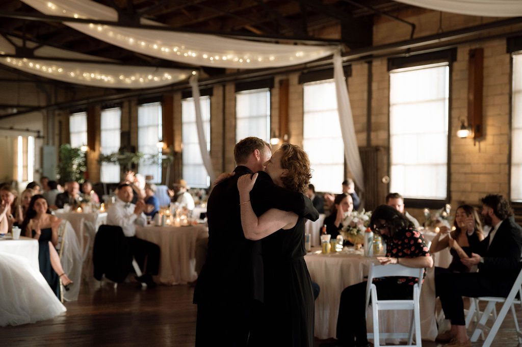 groom and mother dance by Illinois wedding photographer