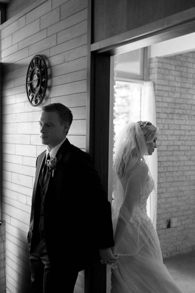 bride & groom first touch by Illinois wedding photographer