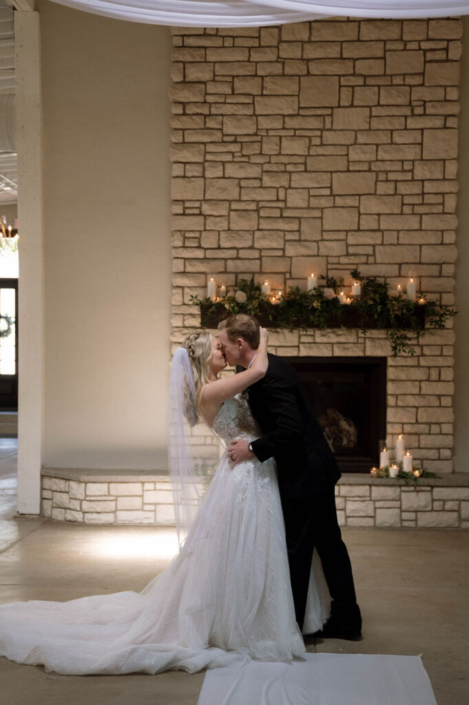 bride & groom first kiss by Illinois wedding photographer