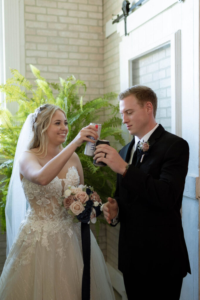 bride & groom cheersing a beer by Illinois wedding photographer 