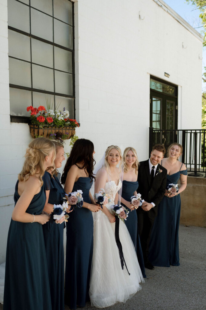 bride & bridesmaids laughing by DFW Wedding Photographer 