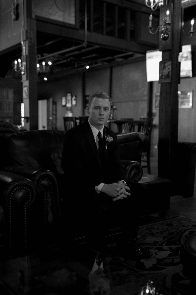 groom sitting inside by DFW Wedding Photographer 