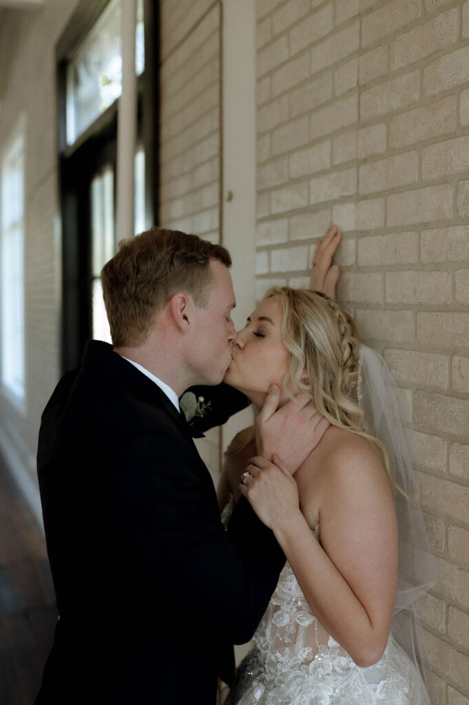 bride & groom kissing inside Olde Wicks Factory by Illinois wedding photographer