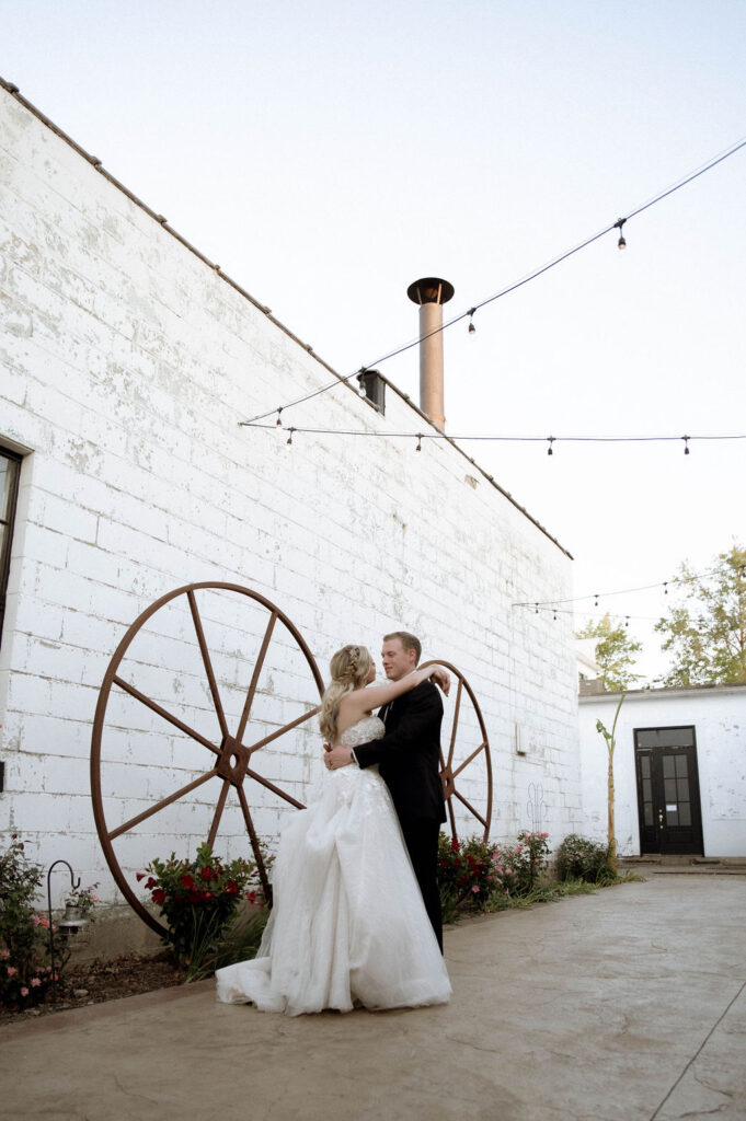 bride & groom embracing by DFW Wedding Photographer 