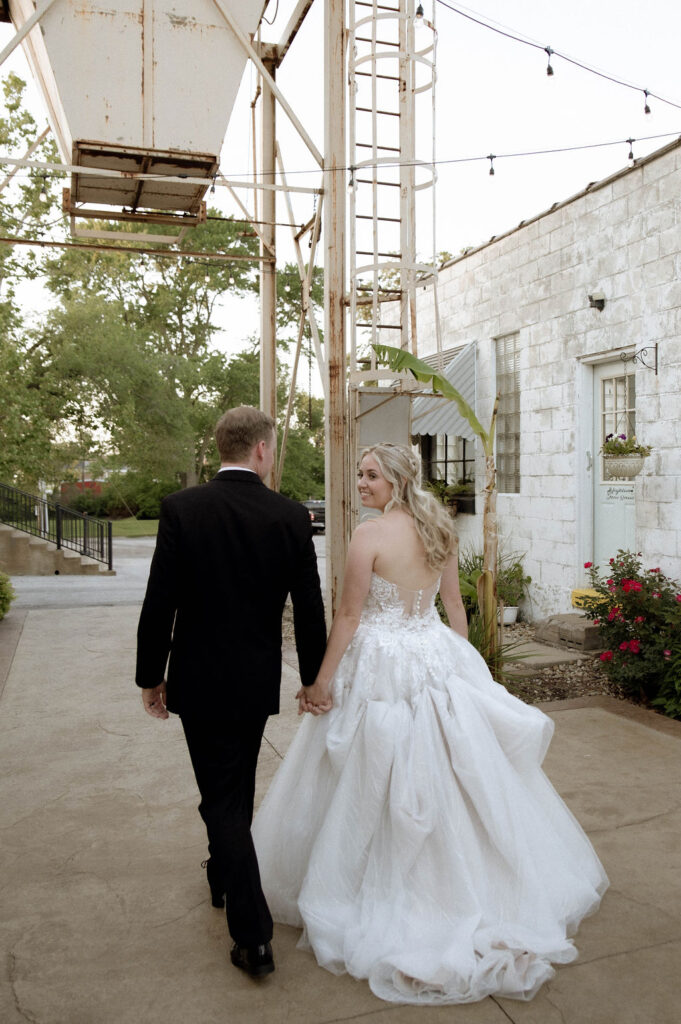 bride & groom walking by DFW Wedding Photographer 