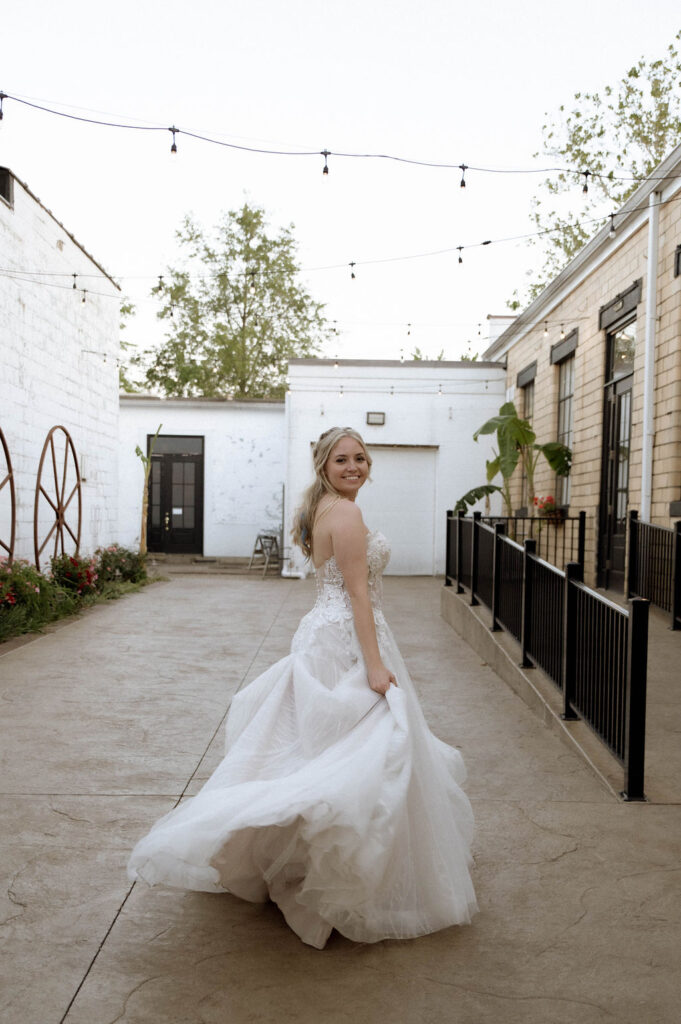 bride twirling by Illinois wedding photographer