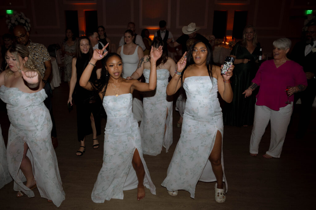 bridesmaids dancing taken by Dallas Wedding Photographer Nicole Endress Photography