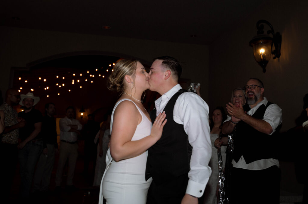 bride and groom kissing goodnight taken by Dallas Wedding Photographer Nicole Endress Photography