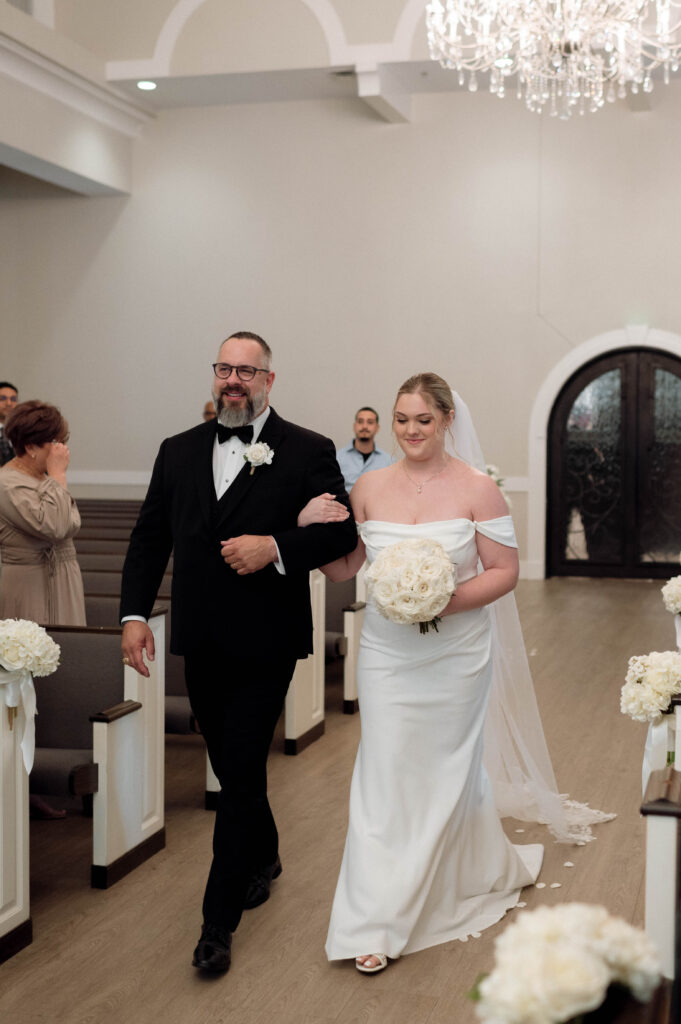 bride and her father walking down the aisle taken by Dallas Wedding Photographer Nicole Endress Photography