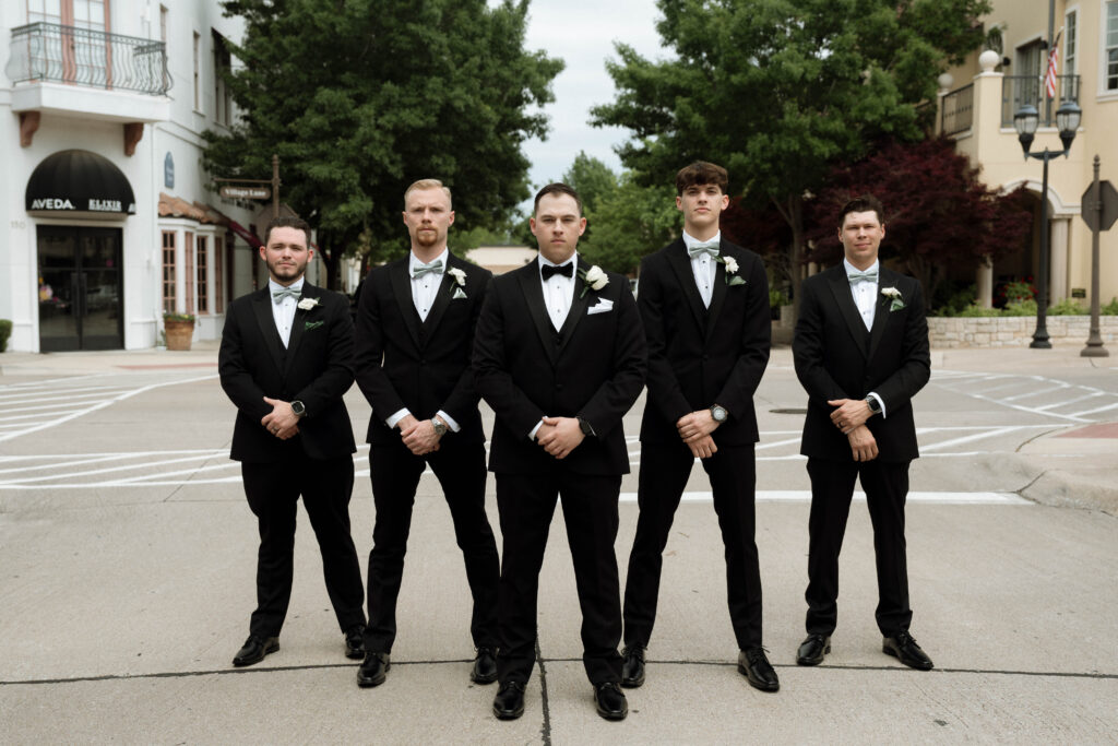 moody photo of groom and groomsmen taken by Dallas Wedding Photographer Nicole Endress Photography