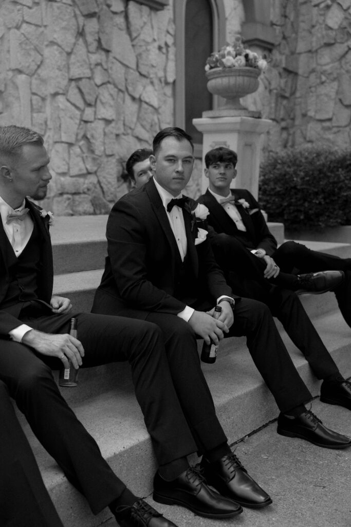 photo of groom surrounded by groomsmen taken by Dallas Wedding Photographer Nicole Endress Photography