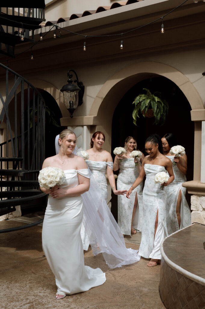 bride and bridesmaids walking taken by Dallas Wedding Photographer Nicole Endress Photography