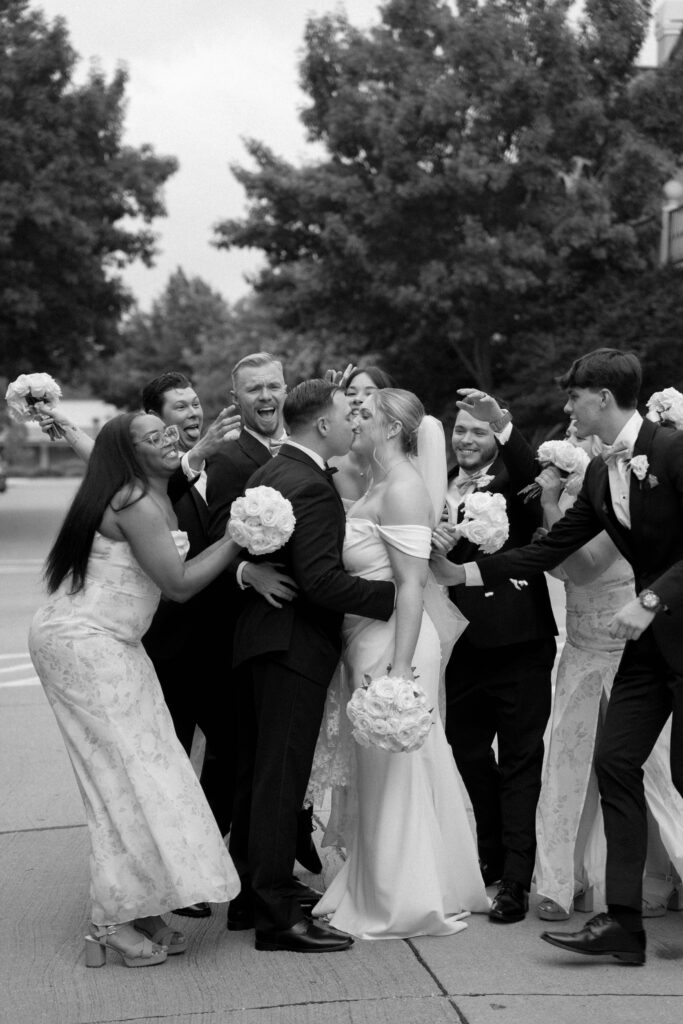 wedding party hugging taken by Dallas Wedding Photographer Nicole Endress Photography