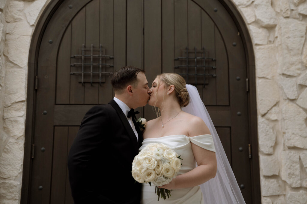 kissing taken by Dallas Wedding Photographer Nicole Endress Photography