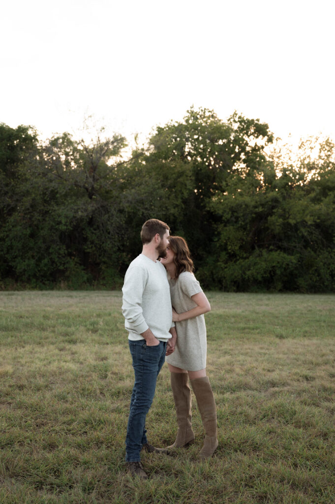 Candid moment of Niki and Evan sharing a laugh during their engagement session in Fort Worth.