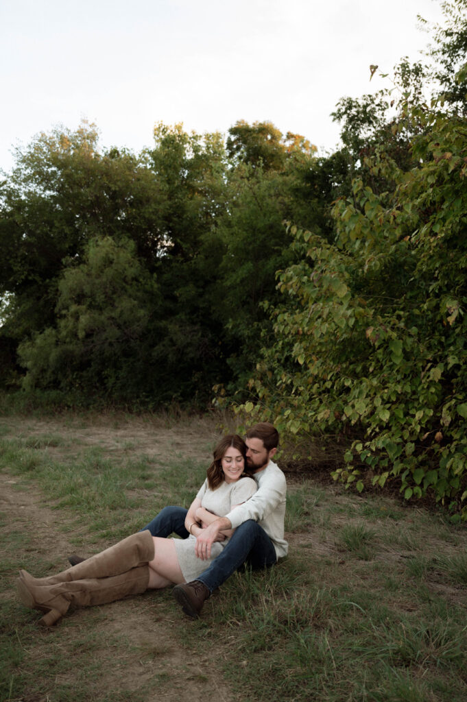 couple sitting on the ground at Arcadia Trail Park in Fort Worth