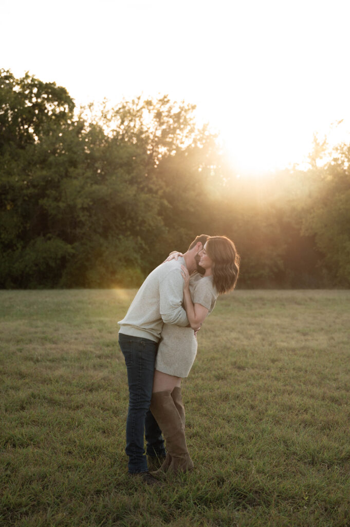 couple embracing during engagement photos in DFW