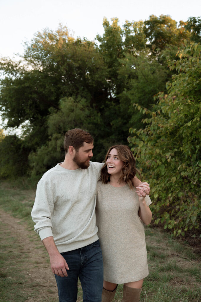 couple laughing together during engagement photos