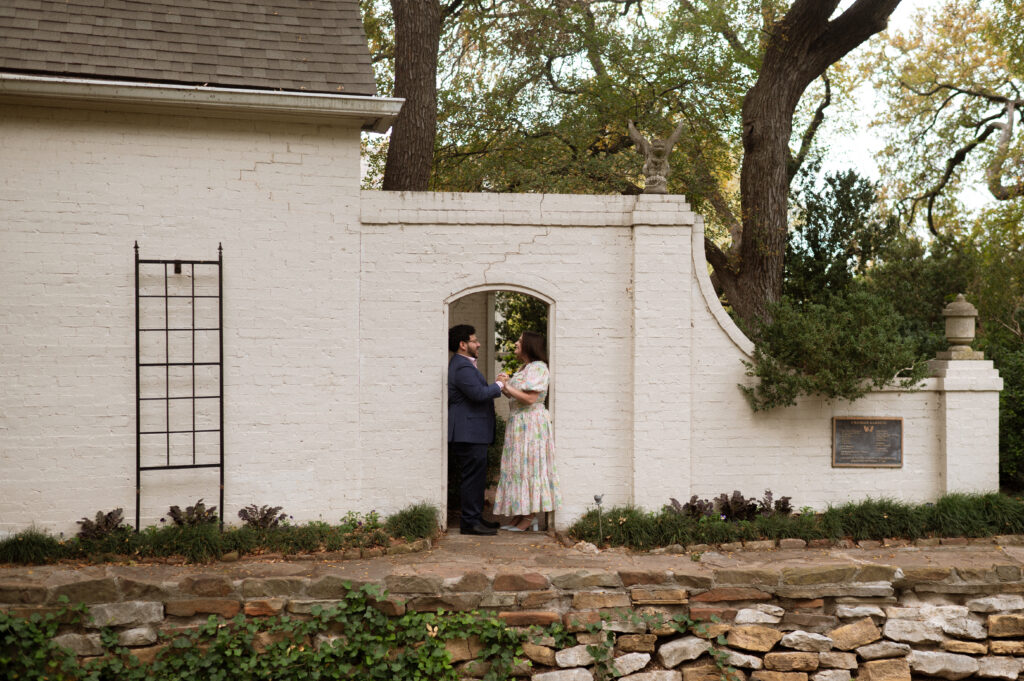 Chandor Gardens stone wall backdrop with romantic couple