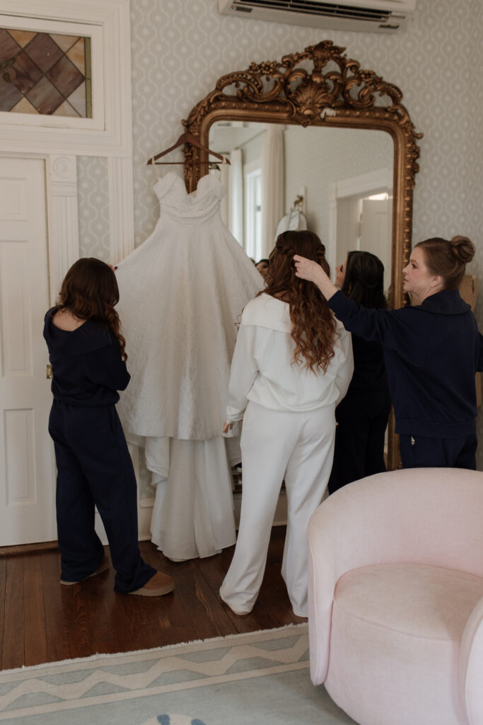 The bride getting ready inside Woodbine Mansion on her wedding day outside of Austin, TX