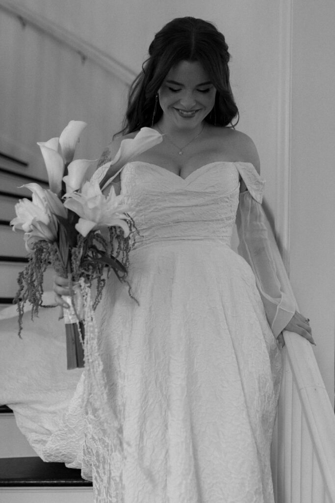 photo of bride walking down the steps at Woodbine Mansion taken by Austin wedding photographer