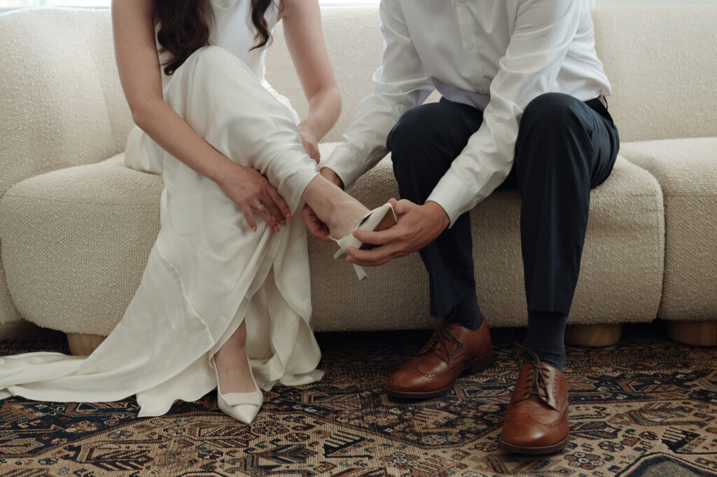bride and groom getting ready together on their wedding day by Austin wedding photographer