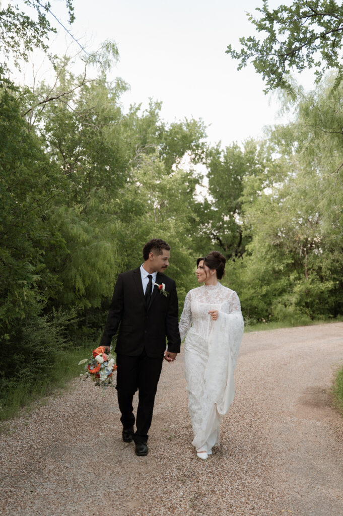 photo of bride & groom walking taken by Dallas Wedding Photographer
