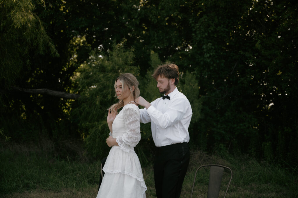 vintage inspired bride and groom getting ready together