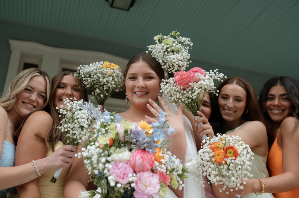 Bride and bridesmaids with their bouquets taken by Dallas Wedding Photographer