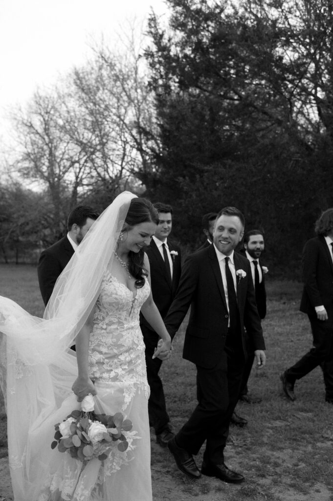 bride and groom walking together at their Dallas wedding