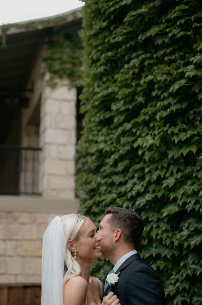 bride and groom laughing together taken by DFW wedding photographer
