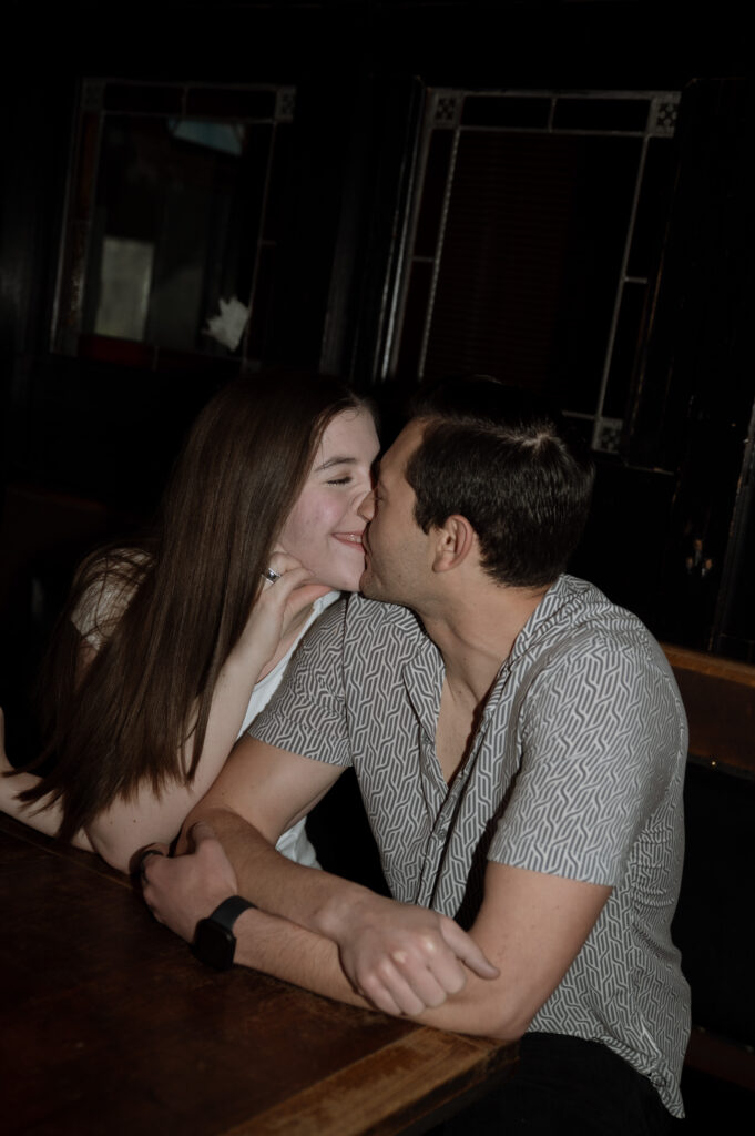 cute couple kissing in Dallas, TX taken by Dallas wedding photographer