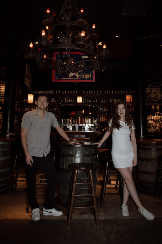 Engaged couple posing inside The Old Monk Pub