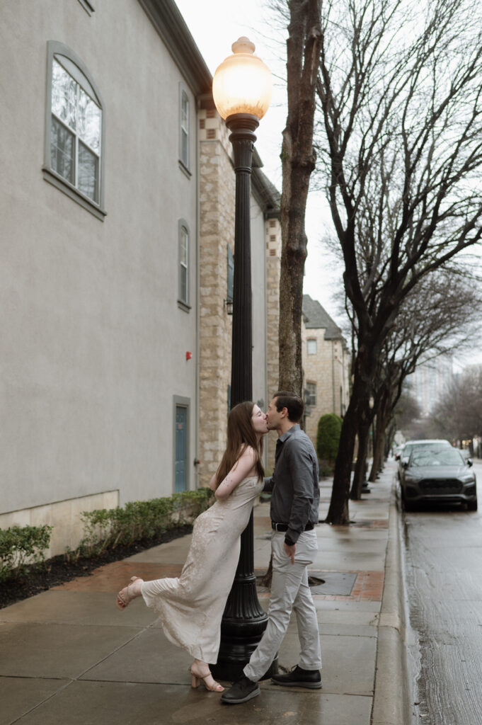 couple kissing under a street lamp