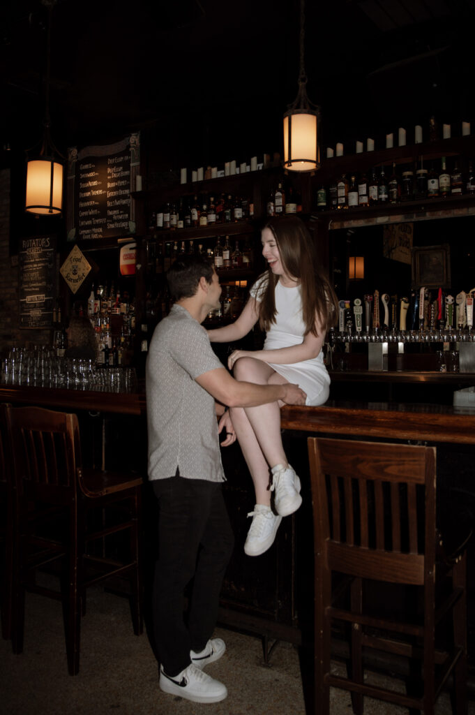 cute engagement photos inside a pub