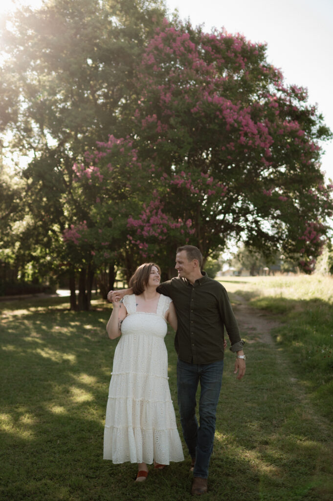 engaged couple walking taken by dallas wedding photographer