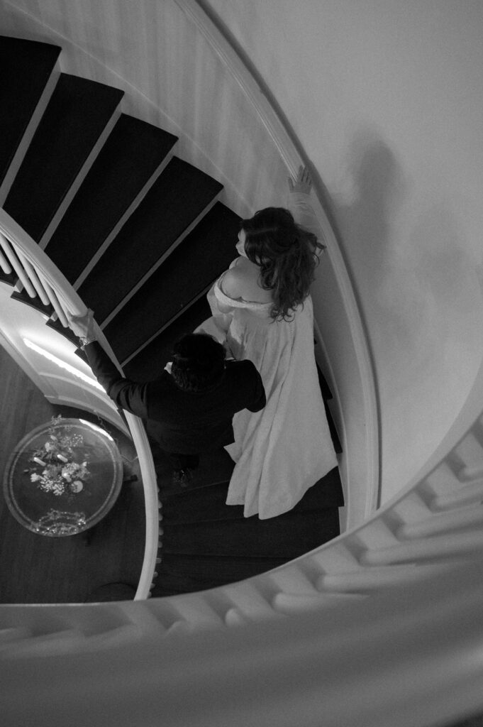 bride and groom walking up the stairs at Woodbine Mansion