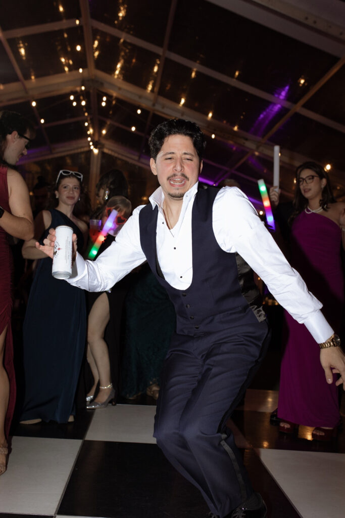 groom dancing on the dance floor at Woodbine Mansion