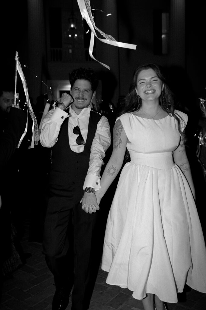 bride and groom exiting their wedding taken by Austin Wedding Photographer