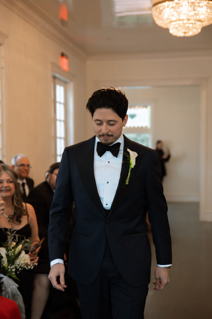 groom walking down the aisle