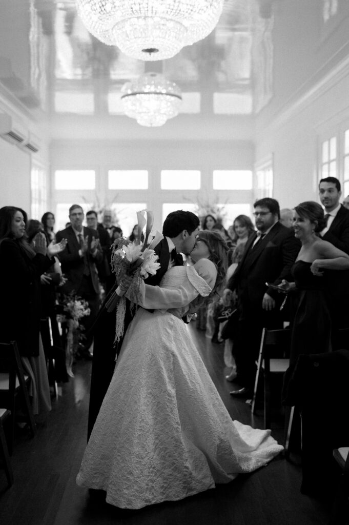 bride and groom kissing after their ceremony