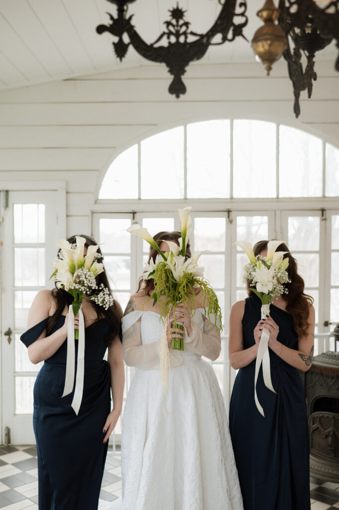 bride and bridesmaid photo holding wedding bouquets
