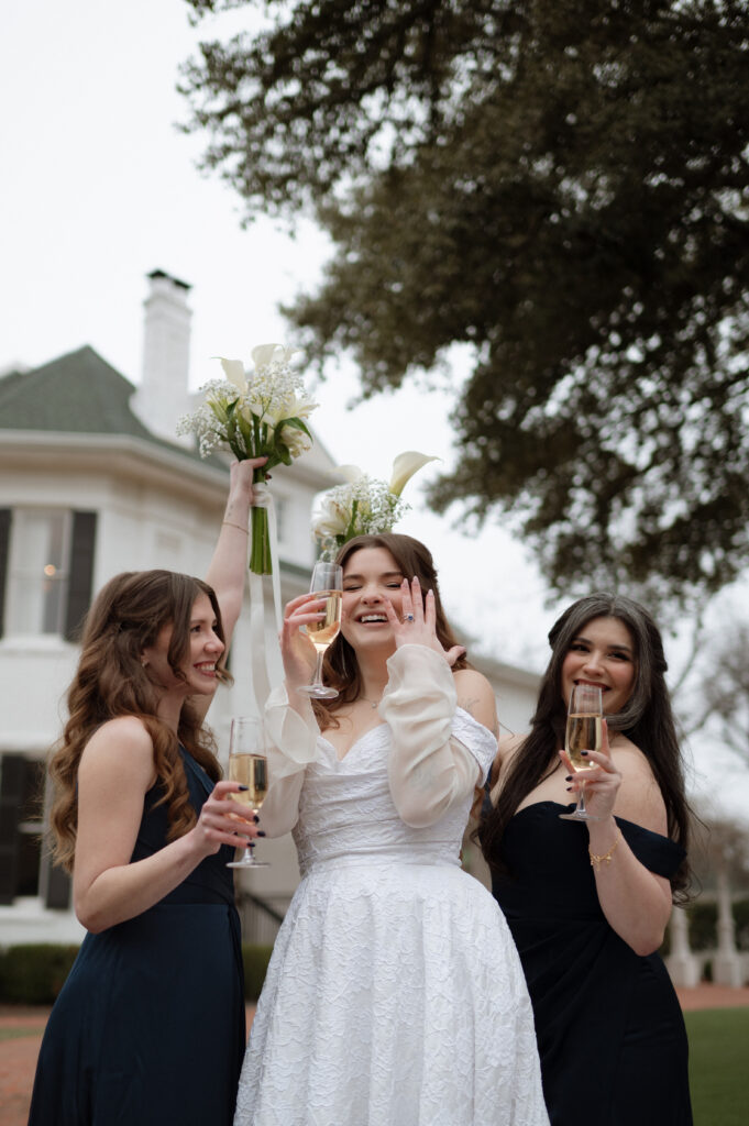bride and bridesmaids celebrating her marriage