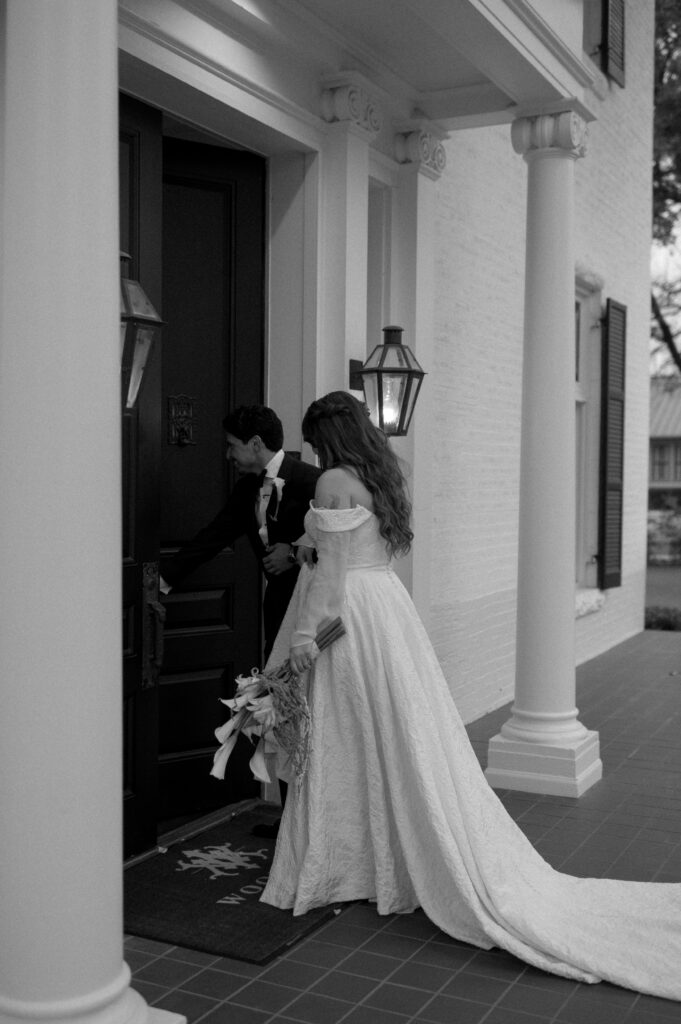 bride and groom walking inside of Woodbine Mansion